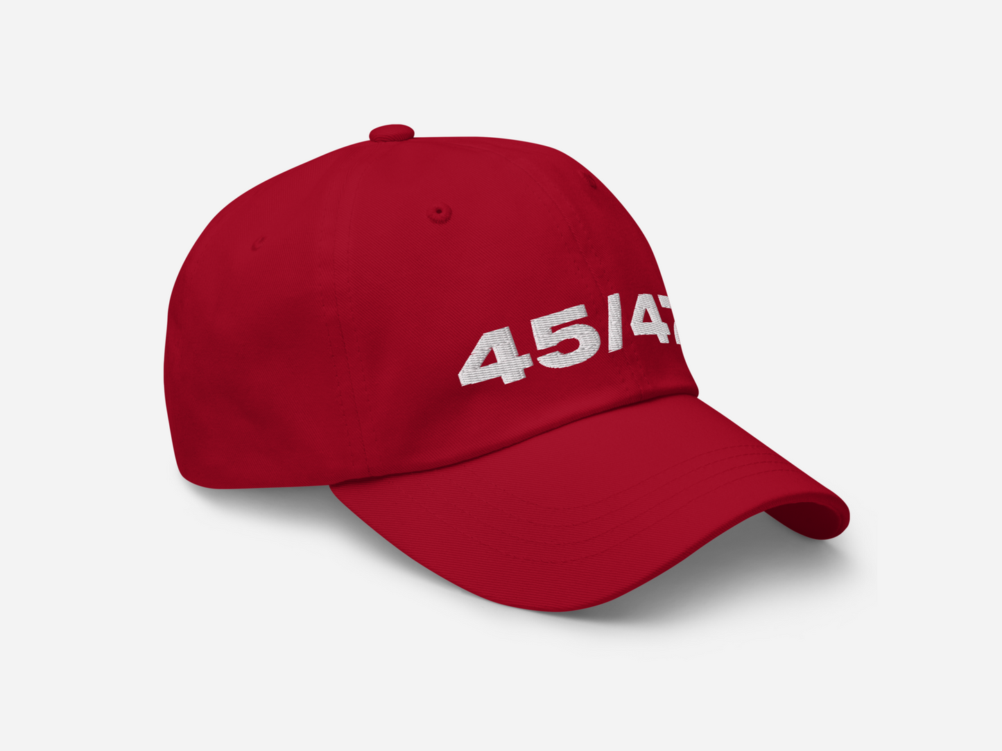 Red dad hat with '45/47' embroidered in bold white text, displayed at a right-angled front view on a white background