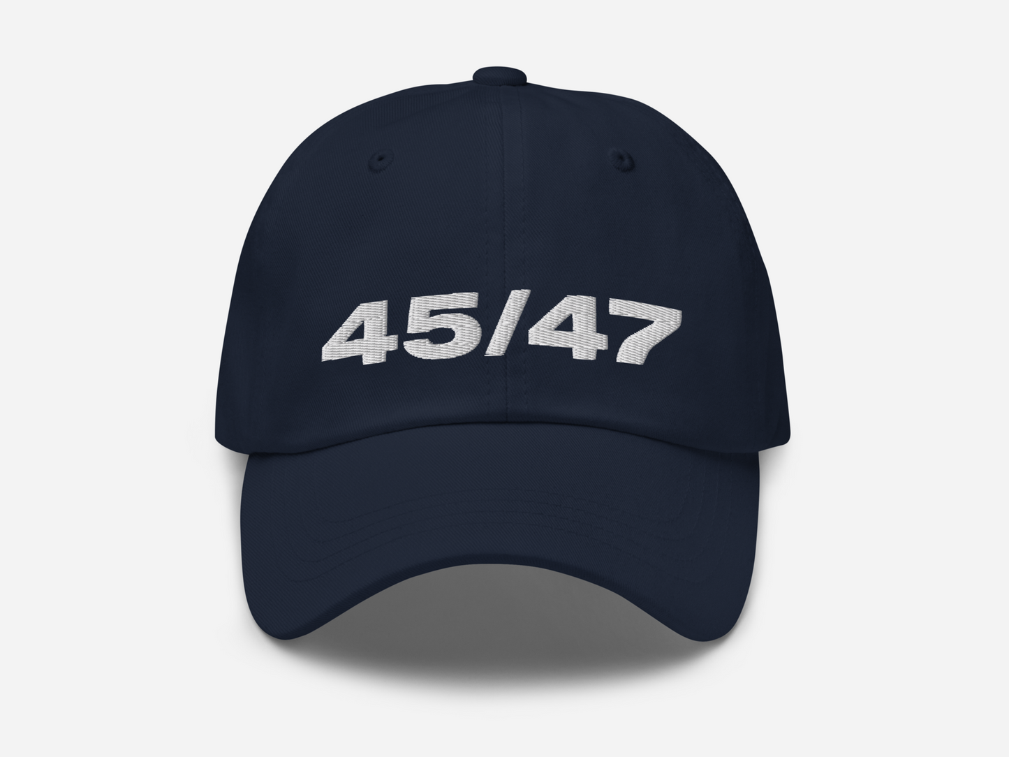 Navy dad hat with '45/47' embroidered in bold white text on the front, displayed against a white background